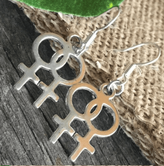 Collier boucles d'oreilles ou collier avec boucles d'oreilles symbole de genre féminin