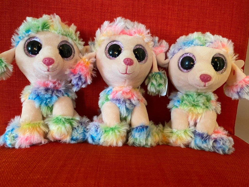 Plush toy dog with rainbow fur