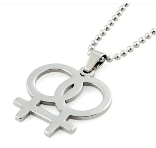 Collier boucles d'oreilles ou collier avec boucles d'oreilles symbole de genre féminin