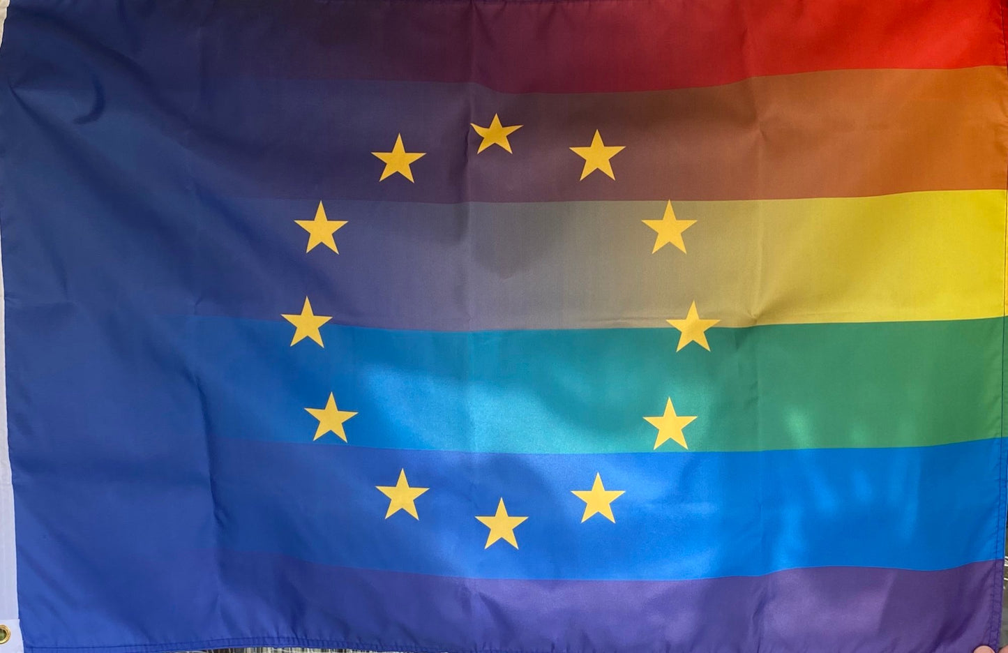 Rainbow flag EU with two eyelets on the left side in two different sizes