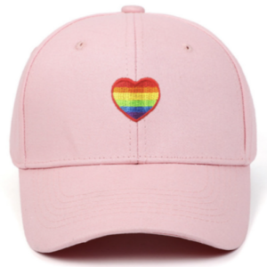 Pink baseball cap with embroidered rainbow heart